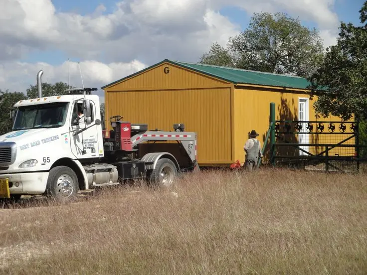 Dirt Road Trucking delivering a Graceland Portable Building in NC